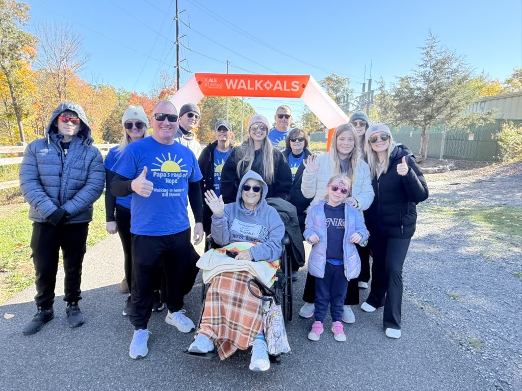 Family and friends in Papa's Rays of Hope shirts at an ALS United walk, walking in honor of Bill Skinner